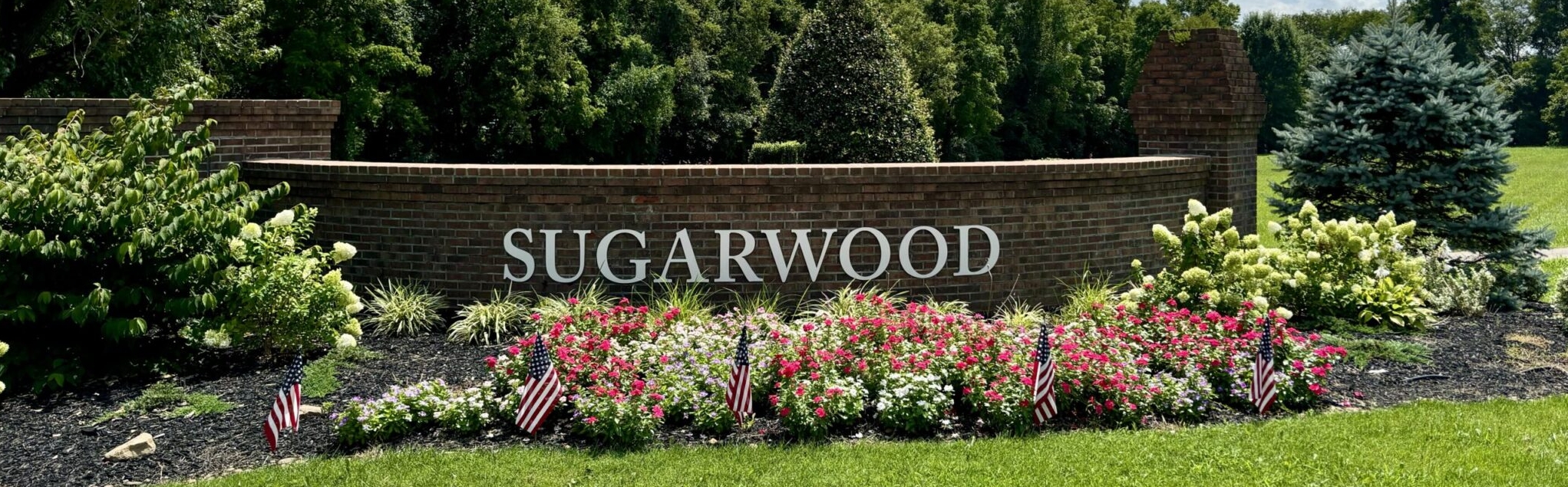 Landscaped Sugarwood neighborhood entrance